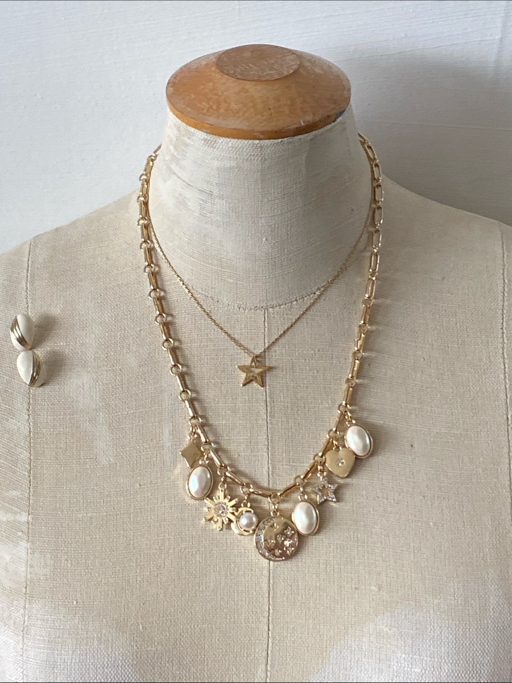 Set set of gold tone, charm necklace, earrings, and gold filled star chain.